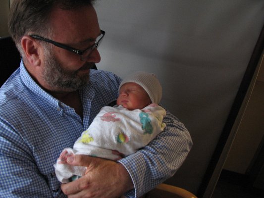 Grandpa Dave holding baby Ellison.